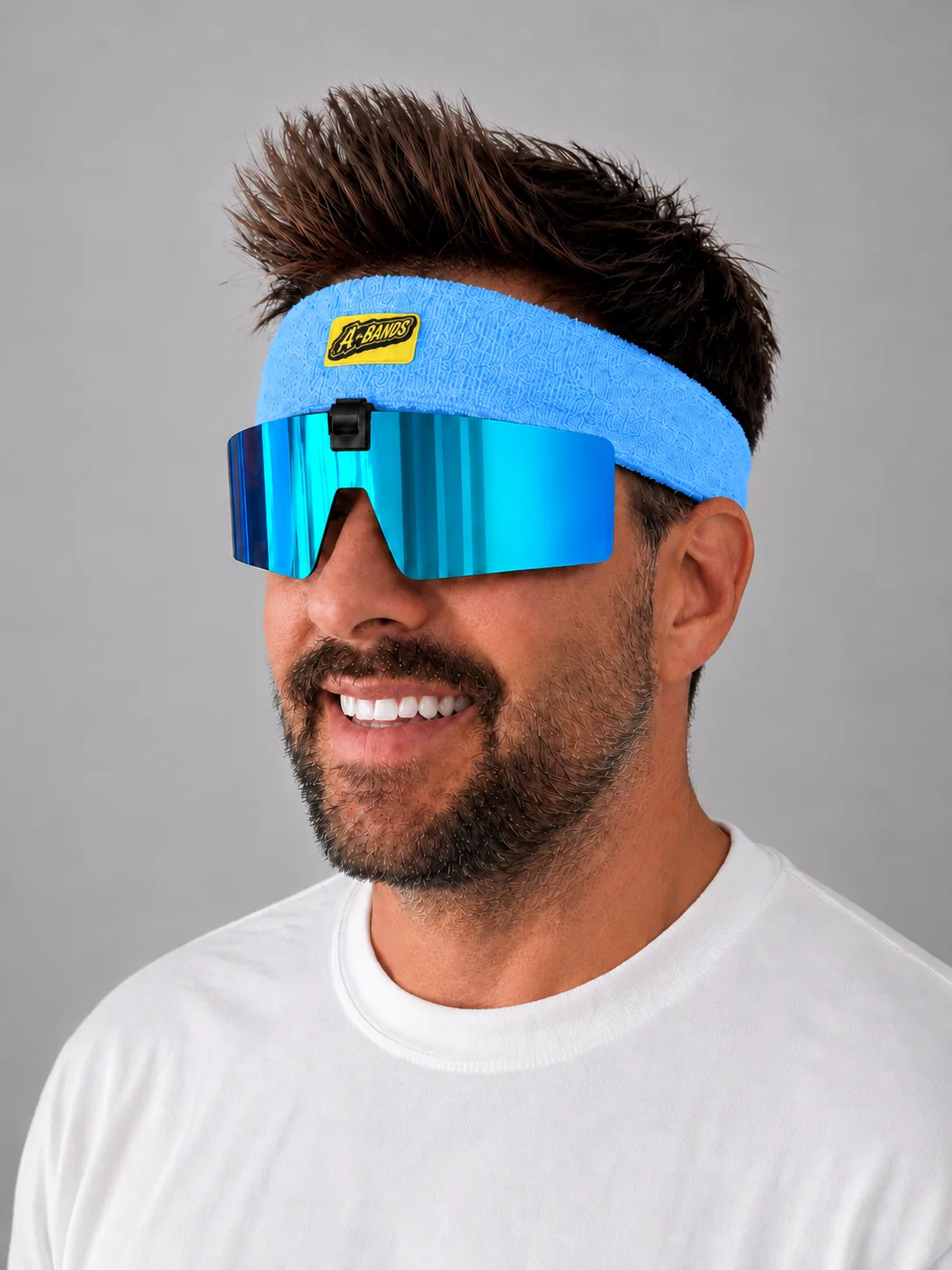 Side view of Blue/Blue A-BANDS flip-up sunglasses on a blue headband