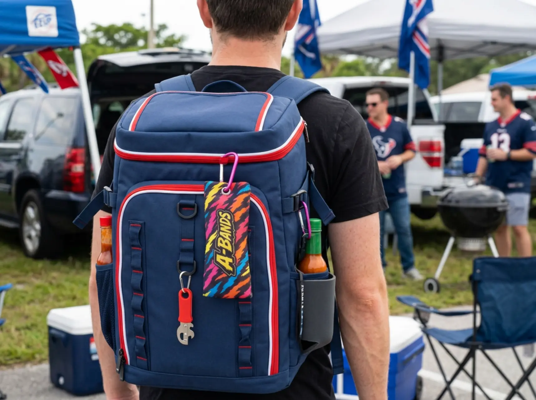 A-BANDS koozie case clipped to a cooler backpack at a tailgate